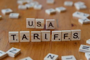 Scrabble tiles spelling out USA Tariffs